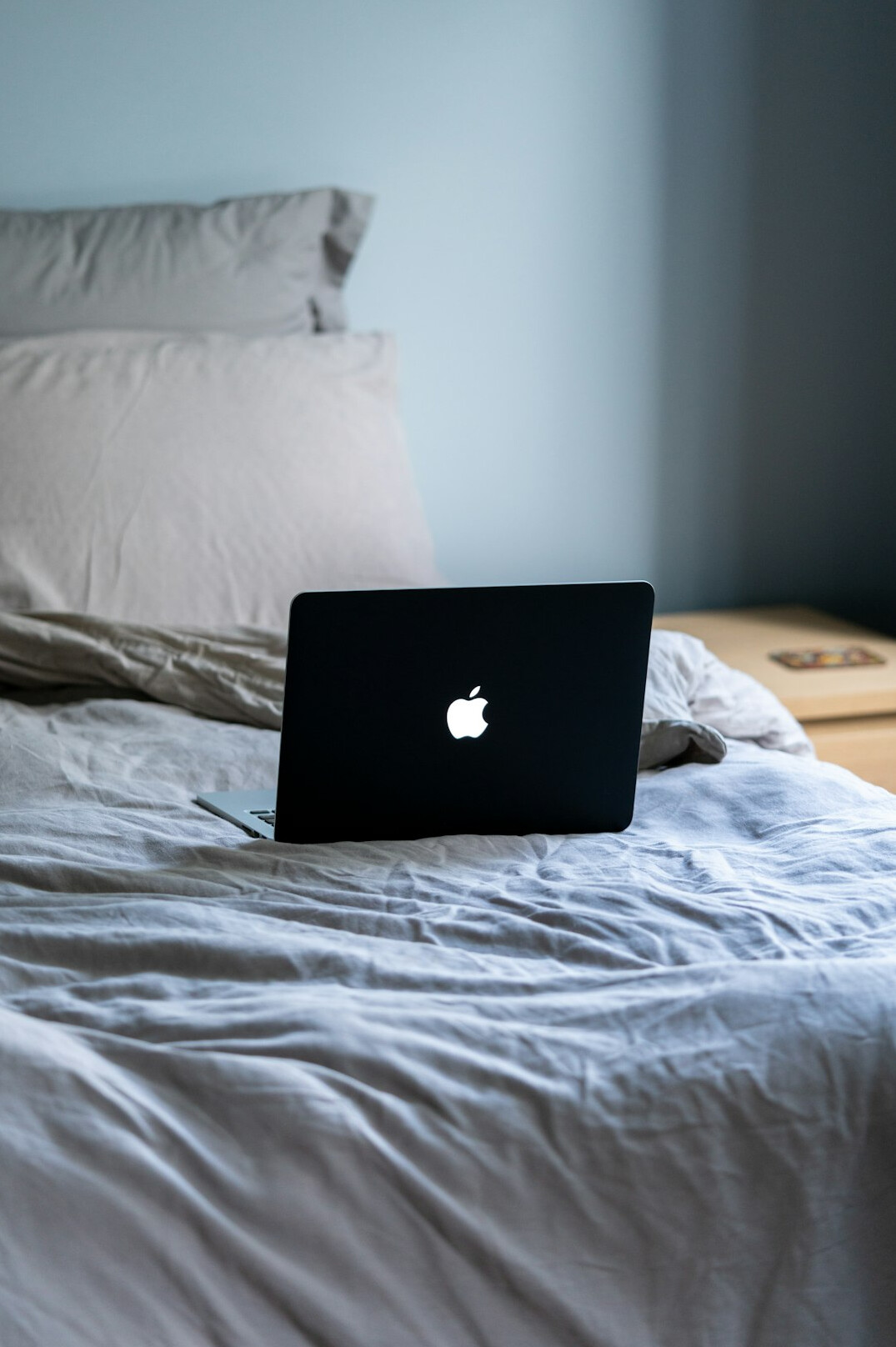 Writer typing content on a laptop at a desk