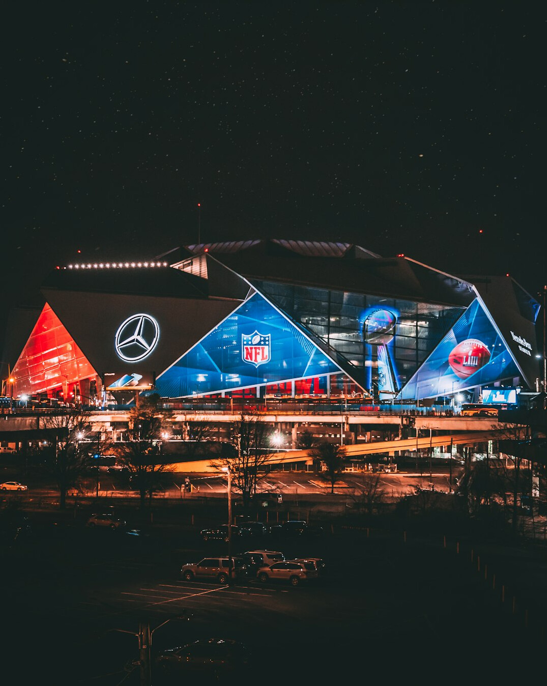 Football stadium at night filled with fans
