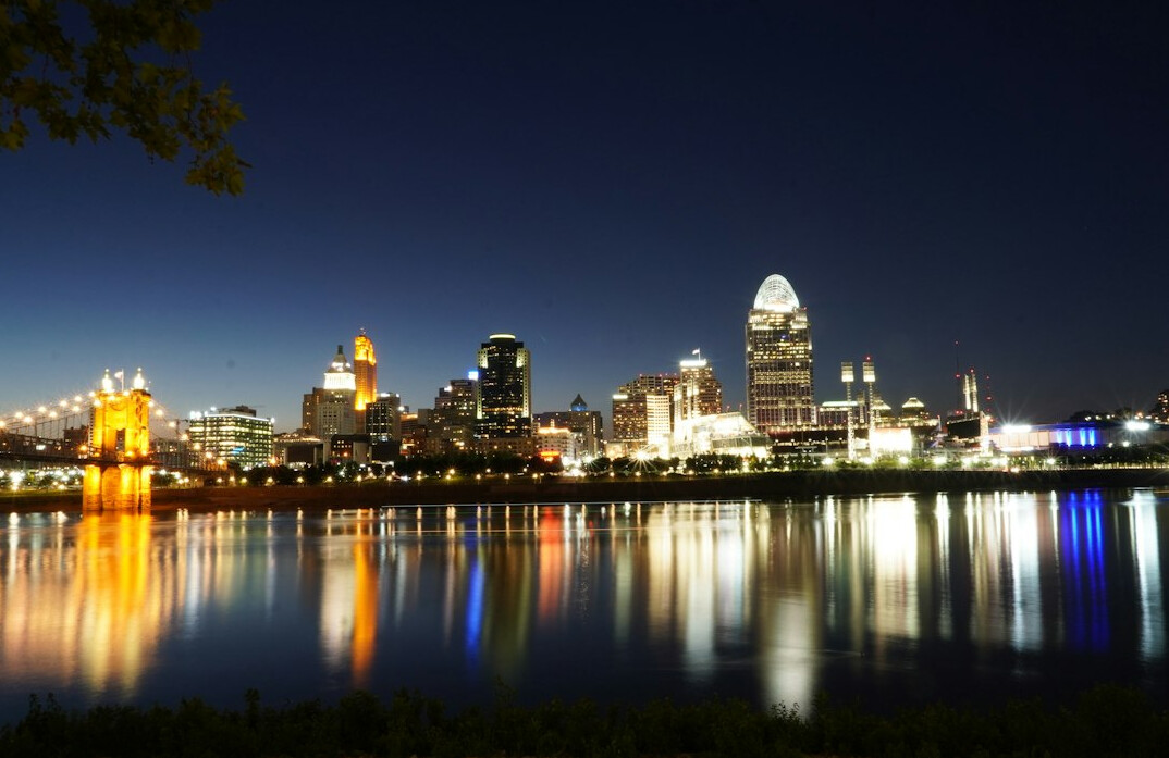 City skyline illuminated at night with reflections