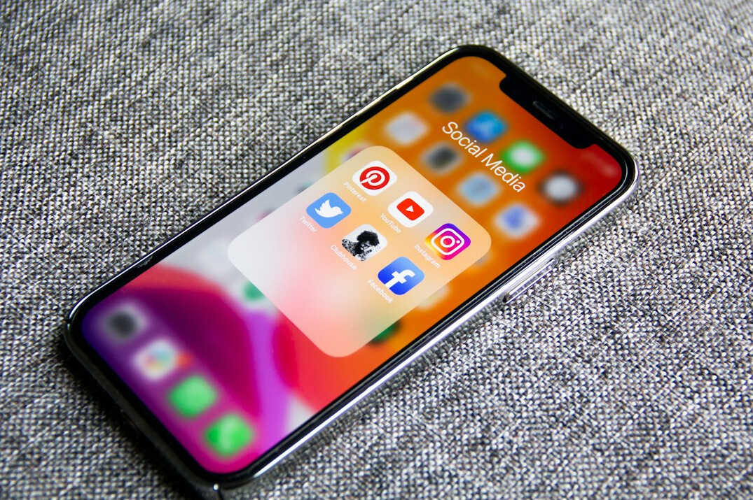 Smartphone displaying social media app icons on screen